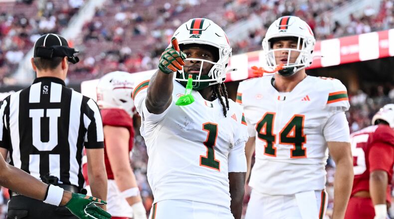 Miami wide receiver Malachi Toney (1) reacts after scoring a touchdown against Stanford during the first half of an NCAA college football game Friday, Sept. 4, 2026, in Stanford, Calif. (AP Photo/Thien-An Troung)