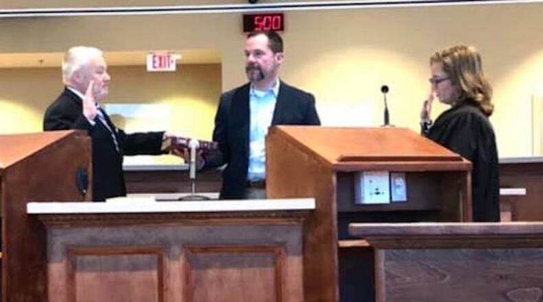 Greg Cannon is sworn into office.