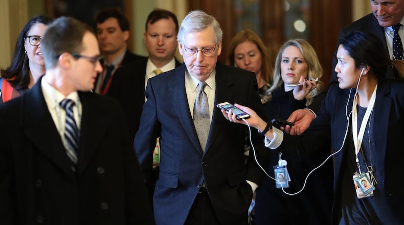 Senate Majority Leader Mitch McConnell (R-KY) is trailed by reporters after speaking on the floor of the U.S. Senate. If he and other congressional leaders fail to end the partial government shutdown by late February, funding for federal low-income housing programs such as housing choice vouchers, previously known as Section 8, will run dry. (Photo by Win McNamee/Getty Images)