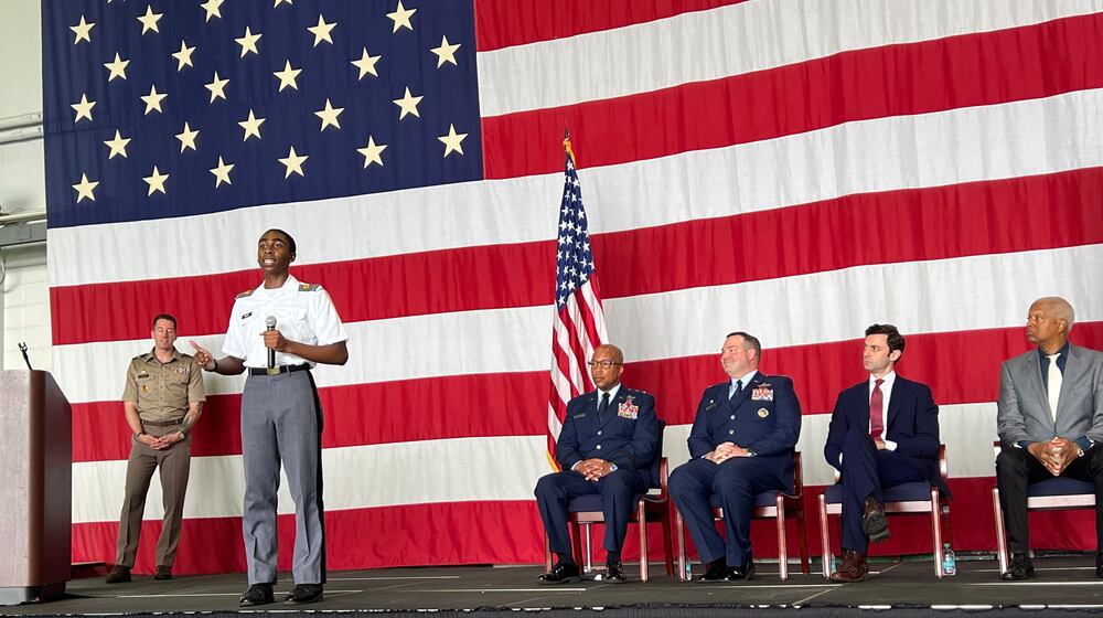 Chad White, a student at the U.S. Military Academy at West Point, speaks to high school students and parents about his experience at West Point. U.S. Sen. Jon Ossoff and Rep. Hank Johnson are in attendance.