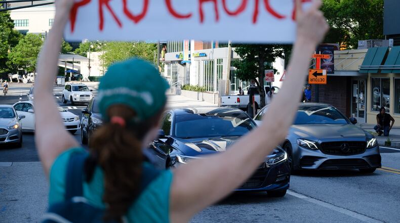 Protestors marched from Centennial Olympic Park to the Capitol in Atlanta on Tuesday, May 3, 2022, the day after a Supreme Court draft opinion was leaked, indicating that Roe v. Wade could be overturned. Supporters of abortion rights are now considering a legal challenge based on privacy, involving a 1903 state Supreme Court ruling, that could keep the procedure legal in Georgia. (Arvin Temkar / arvin.temkar@ajc.com)