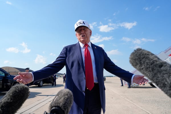 President Donald Trump talks to reporters before boarding Air Force One, Thursday, July 3, 2025, at Joint Base Andrews, Md. (AP Photo/Alex Brandon)