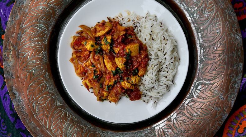 Chicken tikka masala with a side of caraway-spiced rice. (Patrick Farrell/Miami Herald/TNS)