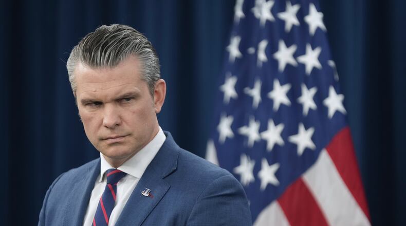 Defense Secretary Pete Hegseth listens during a press briefing at the Pentagon, Monday, March 2, 2026, in Washington. (AP Photo/Mark Schiefelbein)