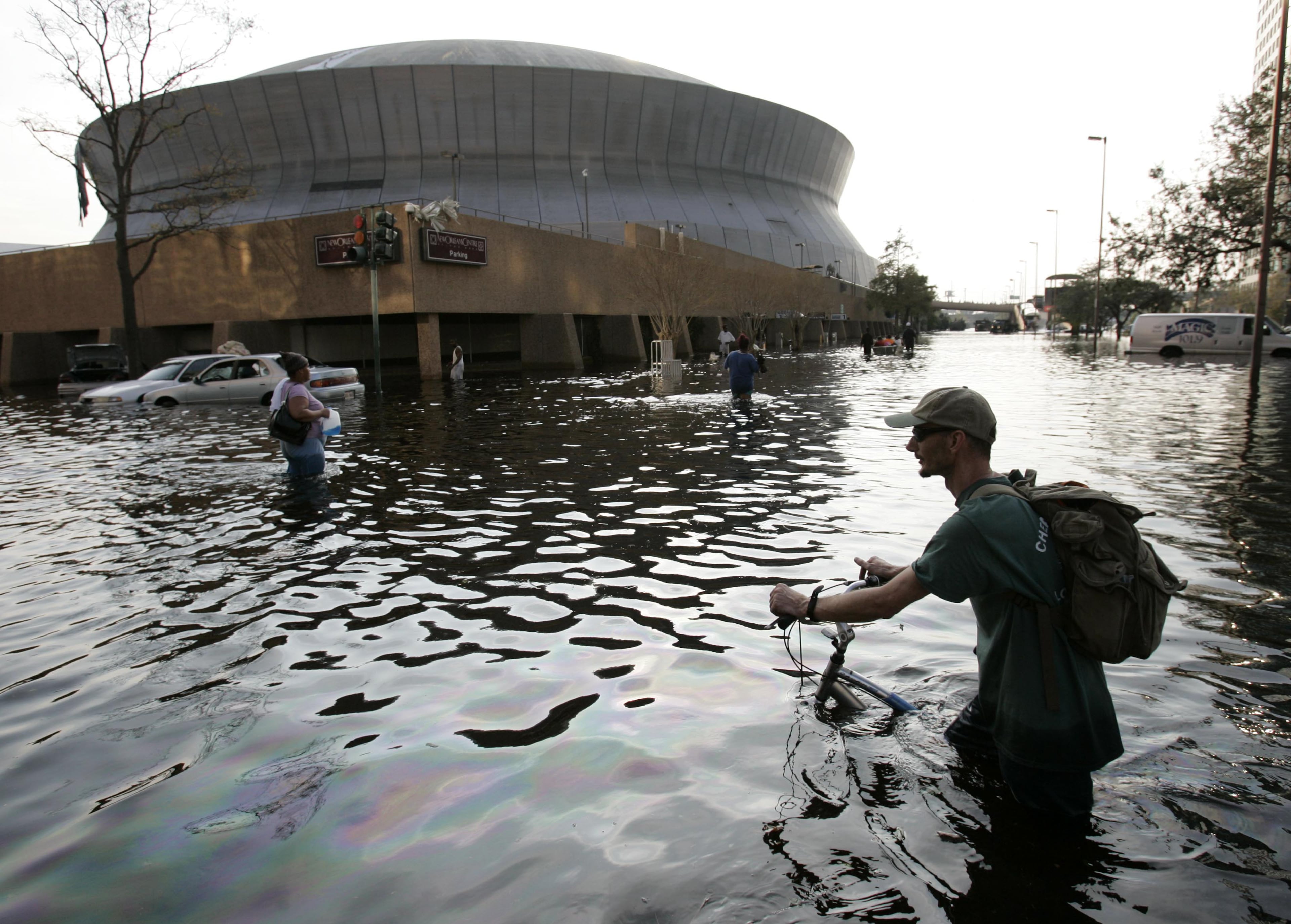 After Hurricane Katrina passed, the water kept coming into New Orleans — rising at a rate of 2 feet per hour — until 80% of the city was flooded. The levees that had held for 40 years failed again, leaving at least 250,000 homes uninhabitable and underwater. (Eric Gay/AP 2005)