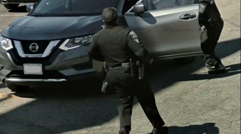 Four suspects, including two accused of murder, were arrested in DeKalb County on Wednesday after police spotted a stolen vehicle (pictured).