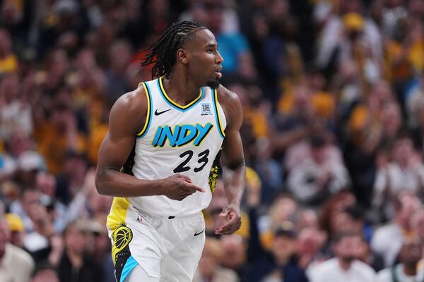 Indiana Pacers forward Aaron Nesmith (23 gestures after a basket against the Milwaukee Bucks during the second half of a first-round NBA basketball playoff game in Indianapolis, Tuesday, April 22, 2025. (AP Photo/Michael Conroy)