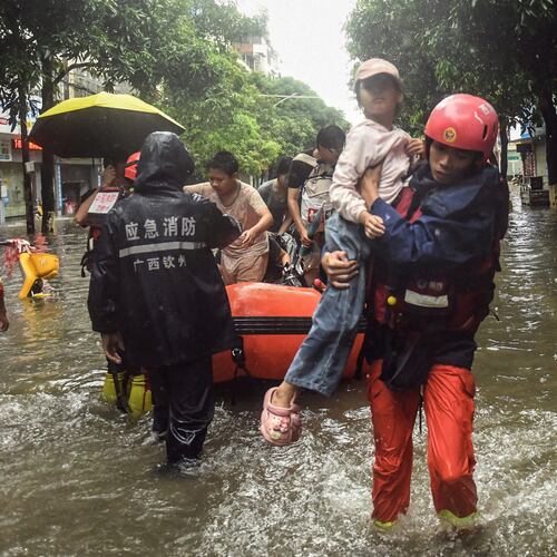 In this photo released by Xinhua News Agency, rescuers evacuate stranded residents in the aftermath of tropical storm Maysak in Qinzhou City, south China's Guangxi Zhuang Autonomous Region Tuesday, July 7, 2026. (Zhang Ailin/Xinhua via AP)