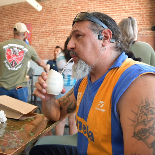 Rene Cufre, of Albuquerque, N.M., sips yerba mate at Cafe Corazon, Monday, June 15, 2026, in Kansas City, Mo. (AP Photo/Kristin M. Hall)