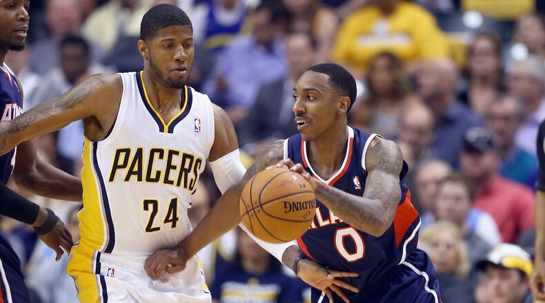 Paul George of the Indiana Pacers defends Jeff Teague of the Atlanta Hawks in Game 2 of the Eastern Conference Quarterfinals during the 2014 NBA Playoffs at Bankers Life Fieldhouse on April 22, 2014 in Indianapolis. (Photo by Andy Lyons/Getty Images)