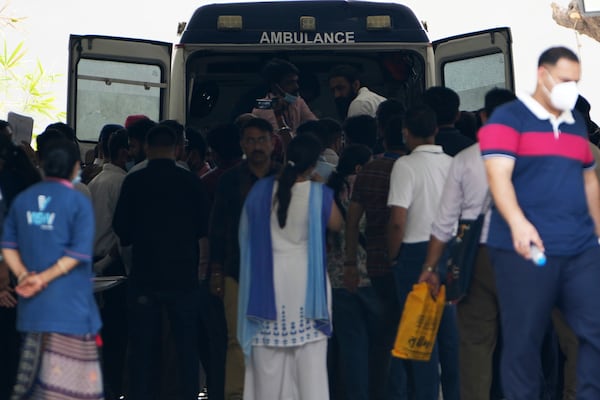 An ambulance transport the body of the victims of Thursday's Air India plane crash at a hospital in Ahmedabad, India, Sunday, June 15, 2025. (AP Photo/Ajit Solanki)