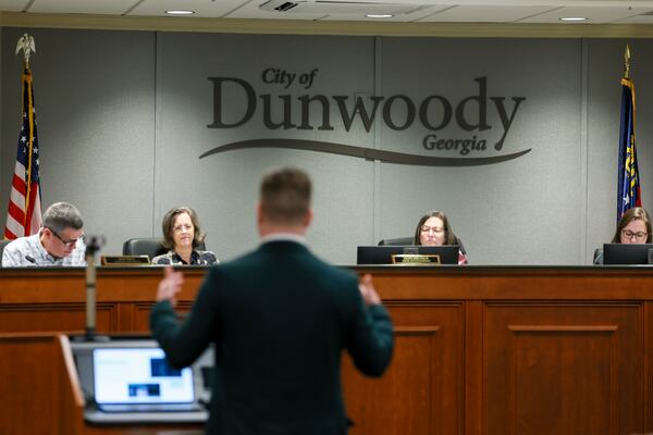Kerry McCormack, a representative with Flock,  gives a presentation to Dunwoody’s City Council at Dunwoody City Hall, Monday, Feb. 23, 2026. (Jason Getz/AJC)