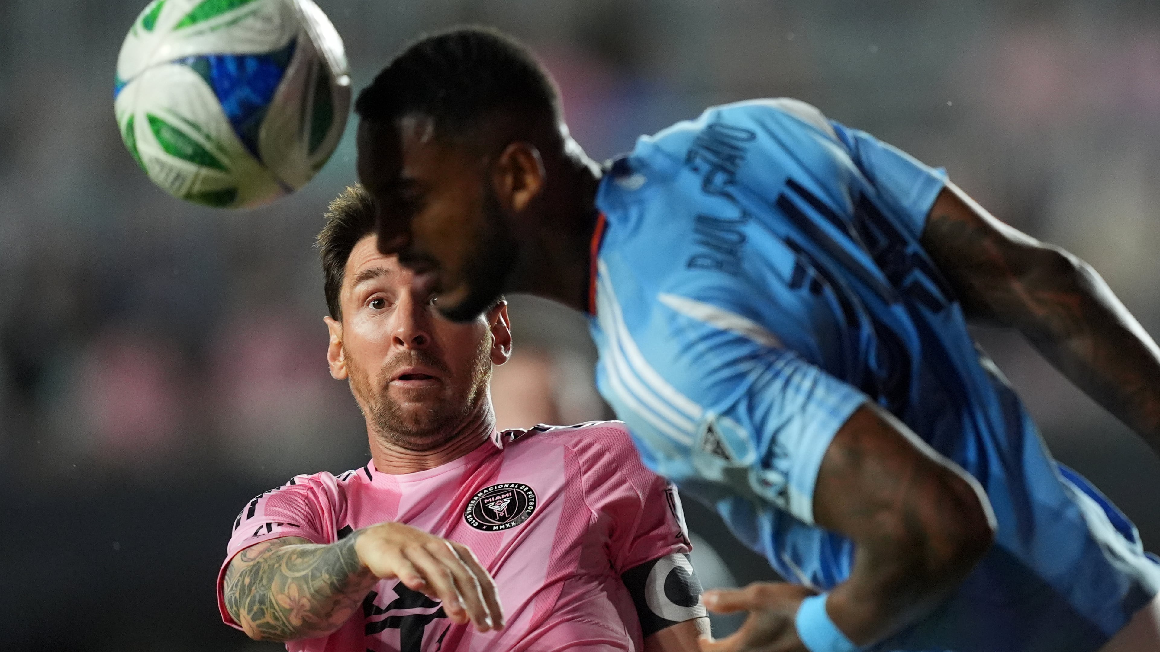 Inter Miami forward Lionel Messi (10) gets beat out for a header by New York City FC defender Raul Gustavo during the first half of an MLS Eastern Conference final soccer match, Saturday, Nov. 29, 2025, in Fort Lauderdale, Fla. (AP Photo/Rebecca Blackwell)