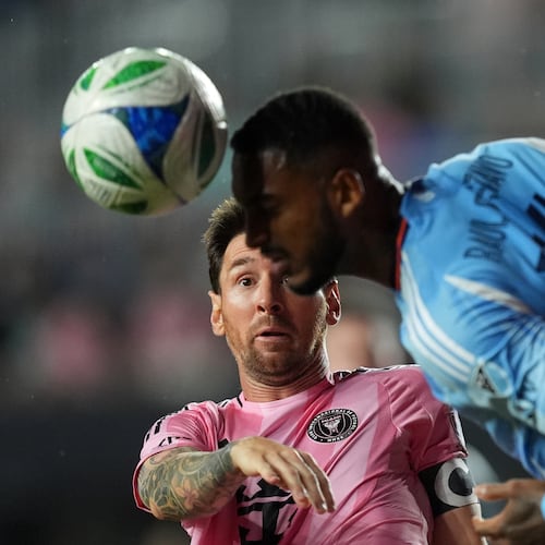Inter Miami forward Lionel Messi (10) gets beat out for a header by New York City FC defender Raul Gustavo during the first half of an MLS Eastern Conference final soccer match, Saturday, Nov. 29, 2025, in Fort Lauderdale, Fla. (AP Photo/Rebecca Blackwell)