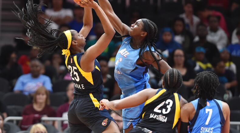 June 19, 2019 Atlanta - Atlanta Dream center Elizabeth Williams (1) blocks a shot by Indiana Fever forward Kennedy Burke (25) during the first half of WNBA basketball game at State Farm Arena in Atlanta on Wednesday, June 19, 2019. Atlanta Dream won 88-78 over the Indiana Fever. HYOSUB SHIN / HSHIN@AJC.COM