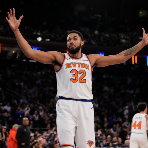 New York Knicks center Karl-Anthony Towns (32) reacts during the first half of an NBA basketball game against the Denver Nuggets, Wednesday, Feb. 4, 2026, in New York. (AP Photo/Yuki Iwamura)