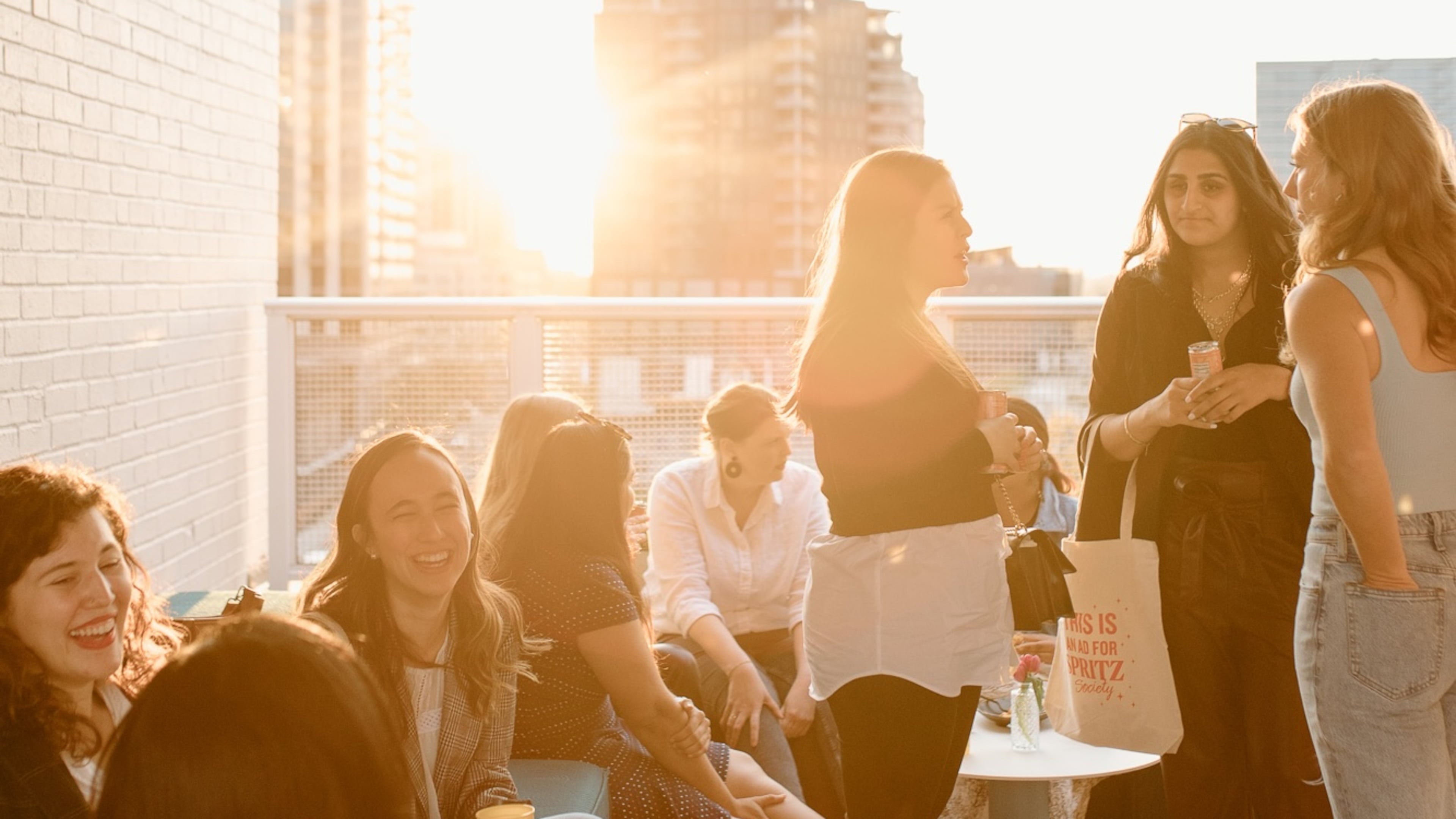 A rooftop sunset event held by Atlanta Girl Gang was not for networking — it was solely for the purpose of helping young adult women make friends. Atlanta was ranked the fourth loneliest city in America in 2024 by the Chamber of Commerce based on the number of individuals living alone. (Courtesy of Atlanta Girl Gang)