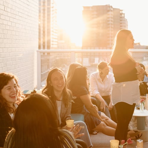 A rooftop sunset event held by Atlanta Girl Gang was not for networking — it was solely for the purpose of helping young adult women make friends. Atlanta was ranked the fourth loneliest city in America in 2024 by the Chamber of Commerce based on the number of individuals living alone. (Courtesy of Atlanta Girl Gang)
