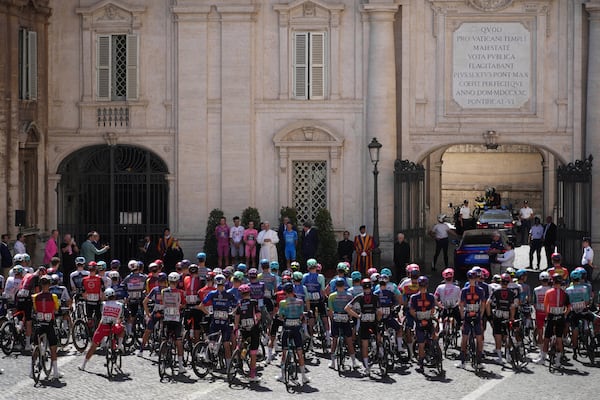 Flanked by race leaders, from left, Denmark's Mads Pedersen, Mexico's Isaac Del Toro, Britain's Simon Yates and Italy's Lorenzo Fortunato, Pope Leo XIV blesses the pack before the start of the final stage of the Giro d'Italia, at the Vatican, Sunday, June 1, 2025. (AP Photo/Andrew Medichini)