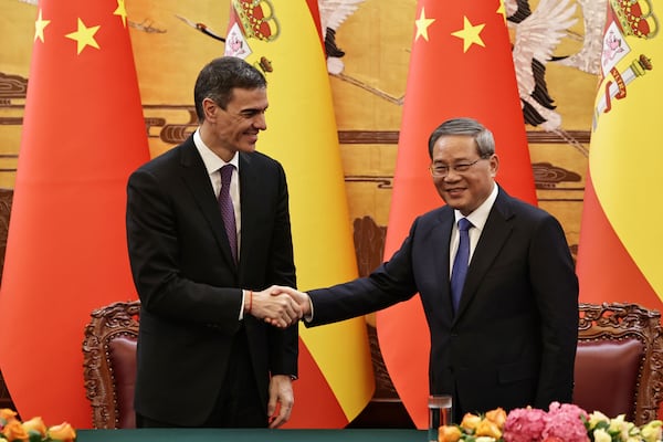 FILE - Spanish Prime Minister Pedro Sanchez, left and Chinese Premier Li Qiang shake hands after a signing ceremony at the Great Hall of the People in Beijing, China, Friday, April 11, 2025. (Andres Martinez Casares/Pool Photo via AP, File)