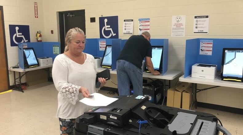 Cathy Watkins of Cartersville inserts her printed-out ballot into a scanner Thursday after voting on Georgia’s new voting machines. Voters in six counties across the state, including Bartow County and its city of Cartersville, are testing the new voting system in this fall’s elections. Voters across Georgia will use the machines in the March 24 presidential primary. MARK NIESSE / MARK.NIESSE@AJC.COM