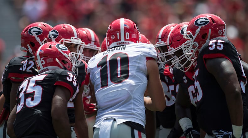 University of Georgia quarterback Jacob Eason (10) during a huddle during the G-Day game Saturday, April 22, 2017, in Athens.