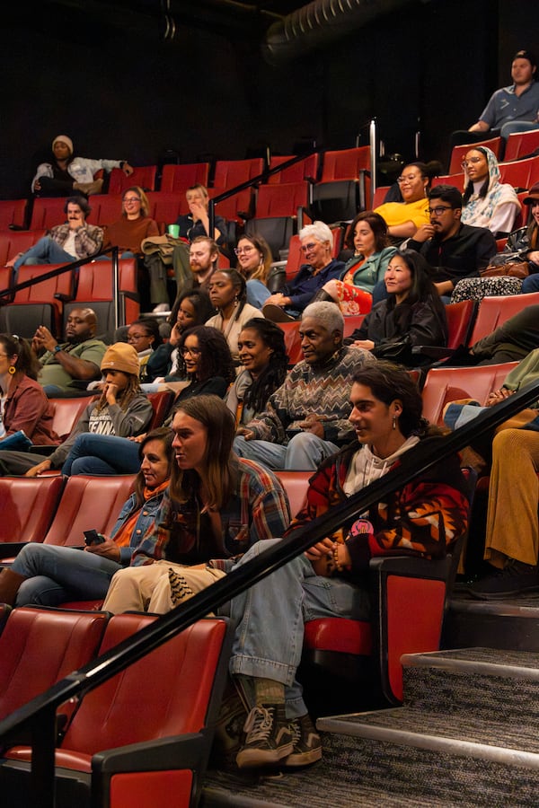 Audience members watch Muscogee (Creek) eder William Harjo perform on a traditional flute during Art of Activism program at 7 Stages Theatre in Atlanta on Friday, Nov. 14, 2025. (Olivia Bowdoin for the AJC)