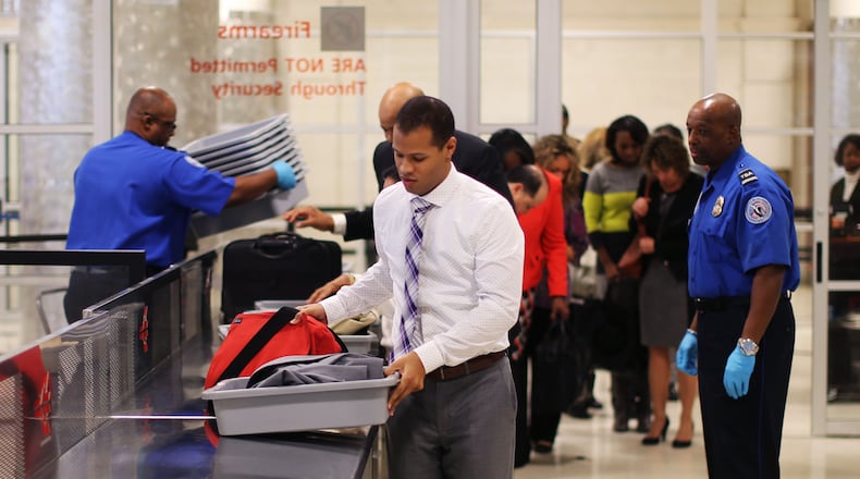 Nov. 23, 2015 - Atlanta - Airport employee Tony O'brien leads the line through security in a timed test to show how possession of prohibited items delays the line. TSA personnel demonstrated how they respond to prohibited items at security checkpoints in a session for the press using airport employees playing the part of passengers. The Transportation Security Administration is advising travelers to keep prohibited items out of their bags to keep security lines moving. At Hartsfield-Jackson Atlanta International Airport, more than 130 people have been caught with guns at airport security checkpoints so far this year. Whenever a gun, explosive or other dangerous weapons are caught at checkpoints, TSA officers halt security screening in the lane and call Atlanta police to respond to the checkpoint. BOB ANDRES / BANDRES@AJC.COM