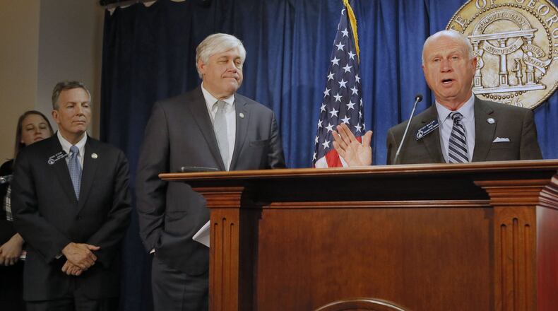 State Sens. Jesse Stone (from left), Bill Cowsert and Butch Miller held a press conference to discuss the adoption bill after its passage Thursday. The Georgia Senate passed House Bill 159 after two hours of debate. The bill, carried by Stone in the Senate, is meant to make adoptions easier and faster, but senators amended it last week to add a provision that Gov. Nathan Deal vetoed last year. BOB ANDRES /BANDRES@AJC.COM