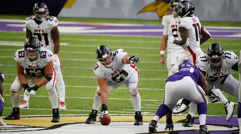 Atlanta Falcons center Alex Mack (51) signals protections from the line of scrimmage against the Minnesota Vikings during the second half Sunday, Oct. 18, 2020, in Minneapolis. (Bruce Kluckhohn/AP)