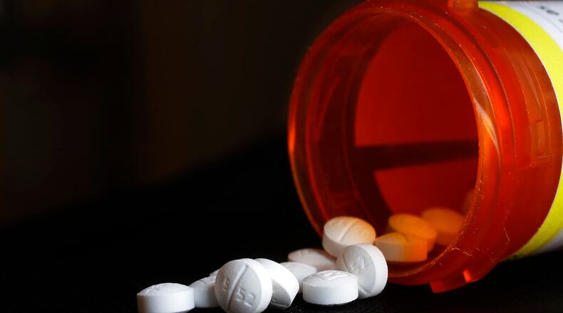 A pharmacist from southern Georgia is heading to federal prison after pleading guilty to a crime involving fraud and illegal distribution of opioids. (AP Photo/Mark Lennihan, File)