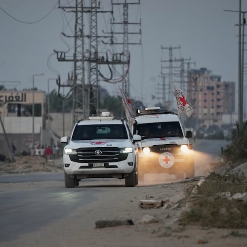 Red Cross vehicles carrying the bodies of two people believed to be deceased hostages handed over by Hamas make their way toward the Kissufim border crossing with Israel, to be transferred to Israeli authorities, in Deir al-Balah, central Gaza Strip, Thursday, Oct. 30, 2025. (AP Photo/Abdel Kareem Hana)