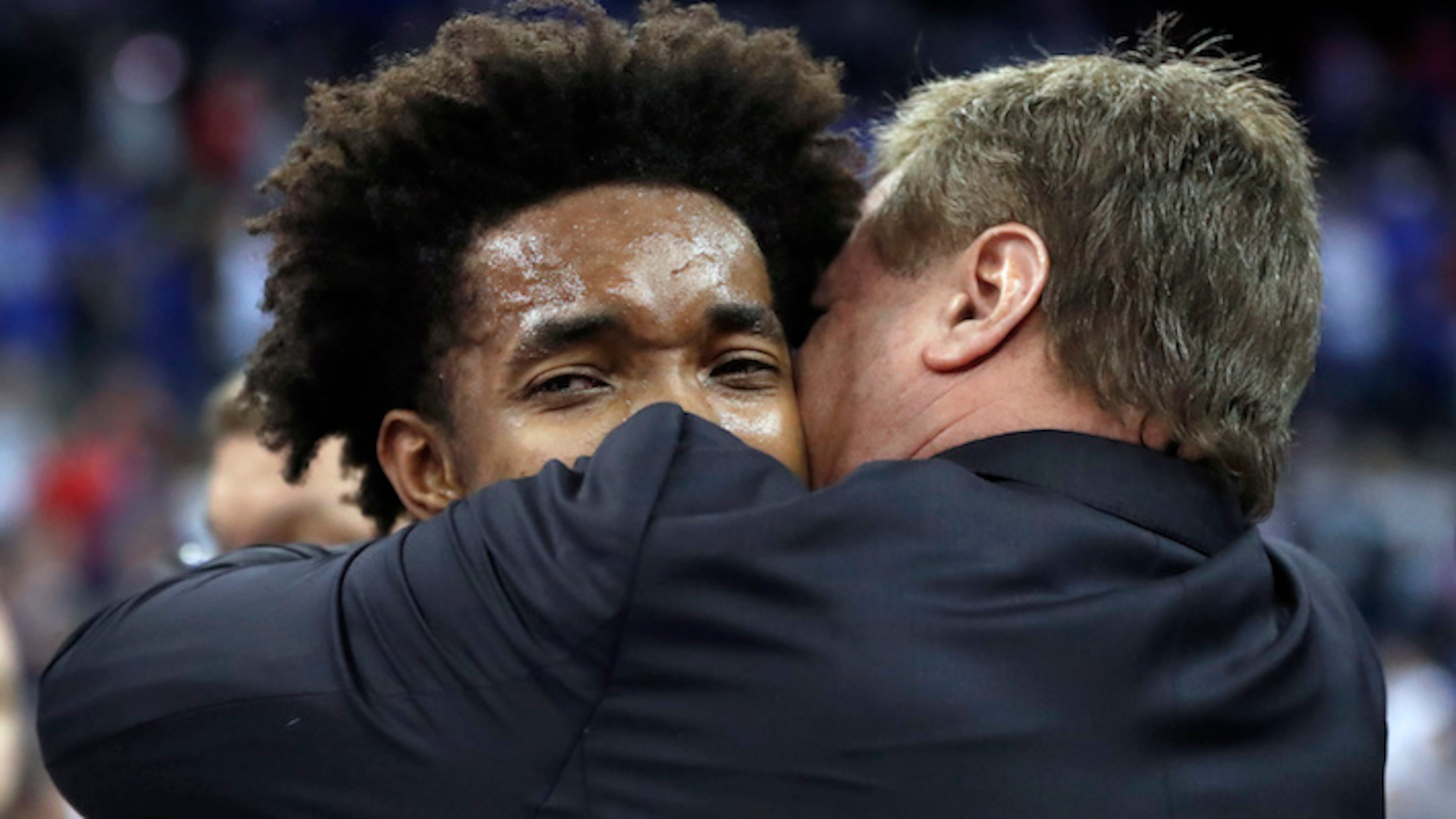 Kansas head coach Bill Self, right, hugs Devonte' Graham following a regional final game against Duke in the NCAA men's college basketball tournament Sunday, March 25, 2018, in Omaha, Neb. (Nati Harnik/AP)