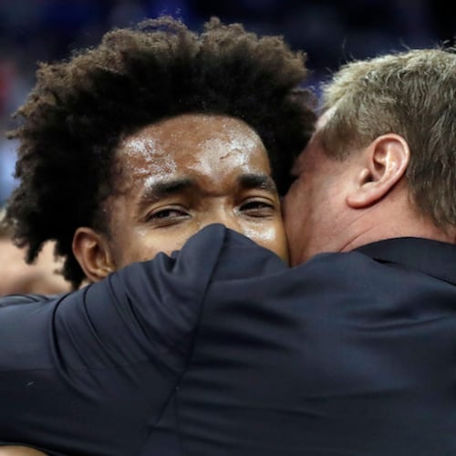 Kansas head coach Bill Self, right, hugs Devonte' Graham following a regional final game against Duke in the NCAA men's college basketball tournament Sunday, March 25, 2018, in Omaha, Neb. (Nati Harnik/AP)