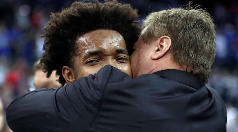 Kansas head coach Bill Self, right, hugs Devonte' Graham following a regional final game against Duke in the NCAA men's college basketball tournament Sunday, March 25, 2018, in Omaha, Neb. (Nati Harnik/AP)