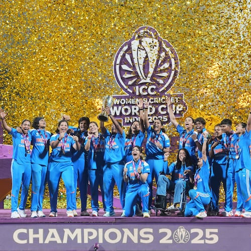 Indian players celebrate with the trophy after their win over South Africa in the ICC Women's Cricket World Cup final match in Navi Mumbai, India, Sunday, Nov. 2, 2025. (AP Photo/Rafiq Maqbool)