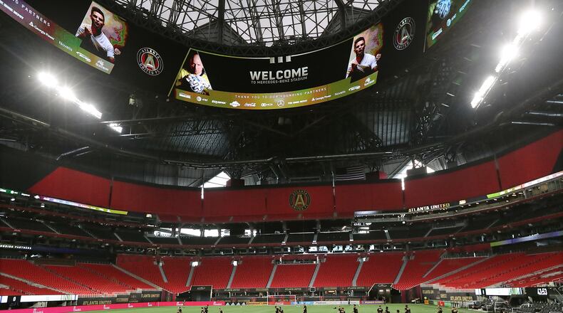 Atlanta United players take the pitch inside a Mercedes-Benz Stadium void of fans to prepare to play Nashville SC on Saturday, Aug. 22, 2020, in Atlanta. (Curtis Compton/Atlanta Journal-Constitution/TNS)
