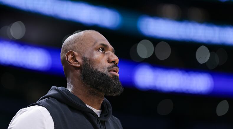 Los Angeles Lakers forward LeBron James looks on before an NBA basketball game against the Phoenix Suns, Friday, April 10, 2026, in Los Angeles. (AP Photo/Jessie Alcheh)
