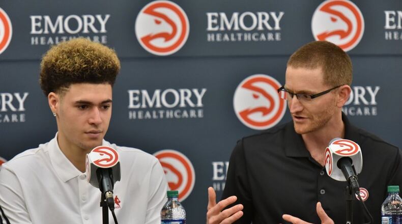 Atlanta Hawks general manager Wes Wilcox speaks as Isaia Cordinier sits next him during a press conference on Tuesday, June 28, 2016.