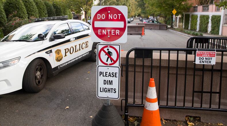 FILE - An officer with the Uniform Division of the United States Secret Service sits in his car at a checkpoint near the home of President Barack Obama, Oct. 24, 2018, in Washington. (AP Photo/Alex Brandon, File)