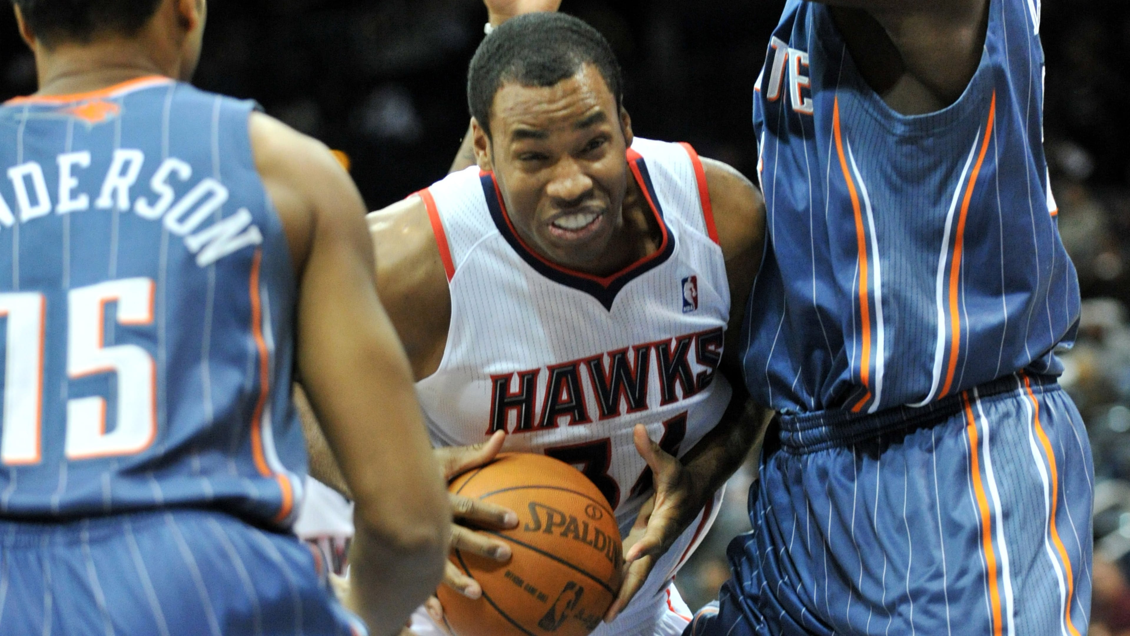 Jason Collins drives against Charlotte Bobcats Kwame Brown (right) during the first half at Philips Arena in Atlanta on Friday, Dec. 17, 2010. (Hyosub Shin/AJC)
