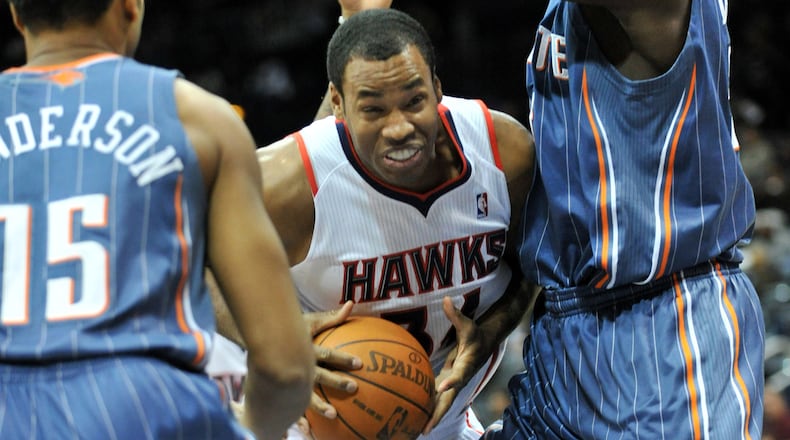 Jason Collins (34) drives against Charlotte Bobcats Kwame Brown (right) during the first half at Philips Arena in Atlanta on Friday, Dec. 17, 2010. Hyosub Shin, hshin@ajc.com
