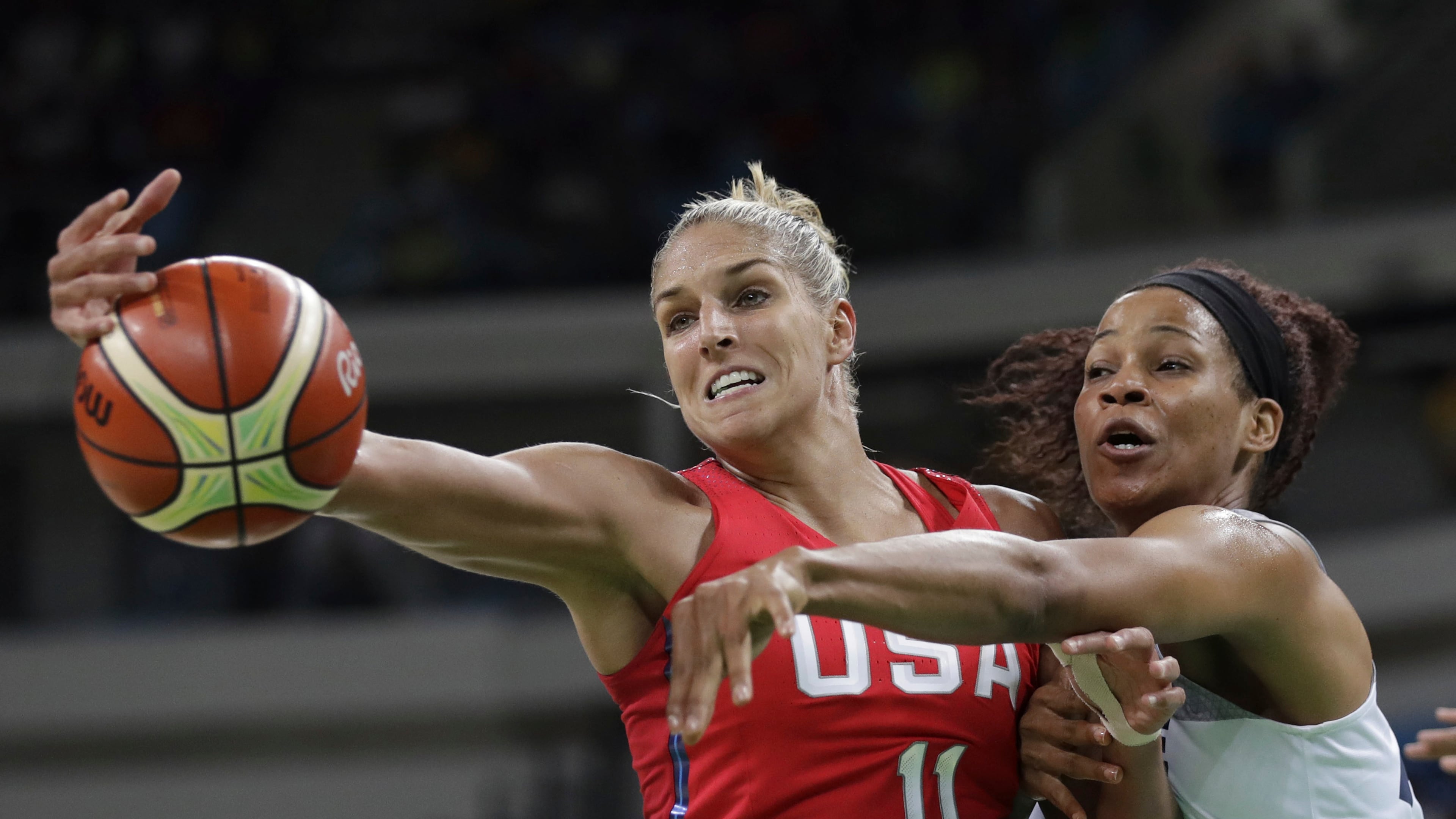 File - This Aug. 18, 2016, file photo shows United States' Elena Delle Donne (11) and France's Marielle Amant, right, reaching out for the ball during a women's semifinal round basketball game at the 2016 Summer Olympics in Rio de Janeiro, Brazil. (AP Photo/Eric Gay, File)