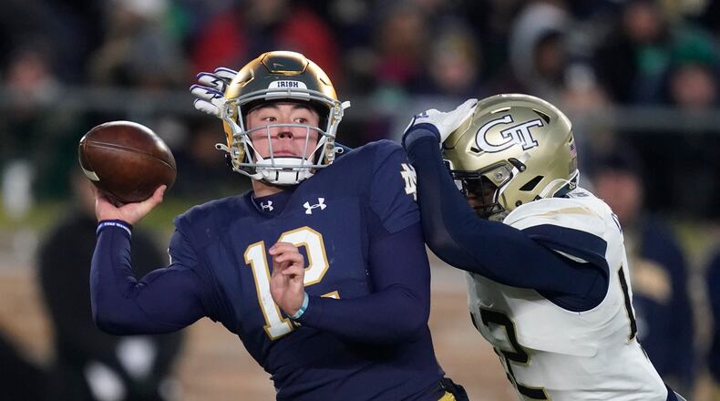 Georgia Tech's Jordan Domineck closes in on Notre Dame's Tyler Buchner last season. Domineck has committed to Arkansas after going in the transfer portal in February. (AP Photo/Darron Cummings)