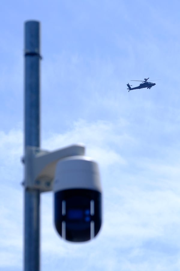 Security patrol around and above the perimeter of the venue ahead of the upcoming NATO summit in The Hague, Netherlands, Monday, June 23, 2025. (AP Photo/Patrick Post)