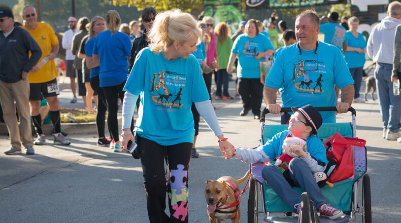 The Hickey family (mom Linda and dad Grant, along with Jonny and his beloved four-legged companion Xena) at the Jonny and Xena "Spread the Words" 5k, which returns this weekend.