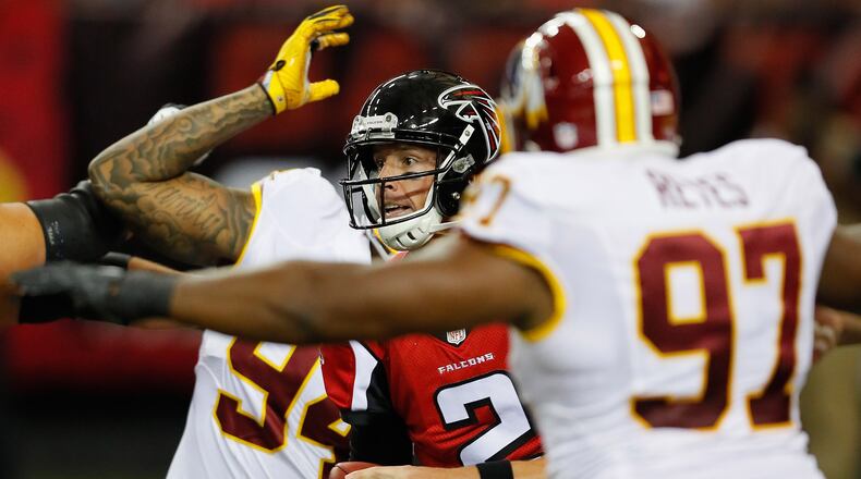 Falcons quarterback Matt Ryan is pressured by Washington Redskins defenders during their last meeting, an Aug. 11, 2016, exhibition meeting at Georgia Dome in Atlanta.