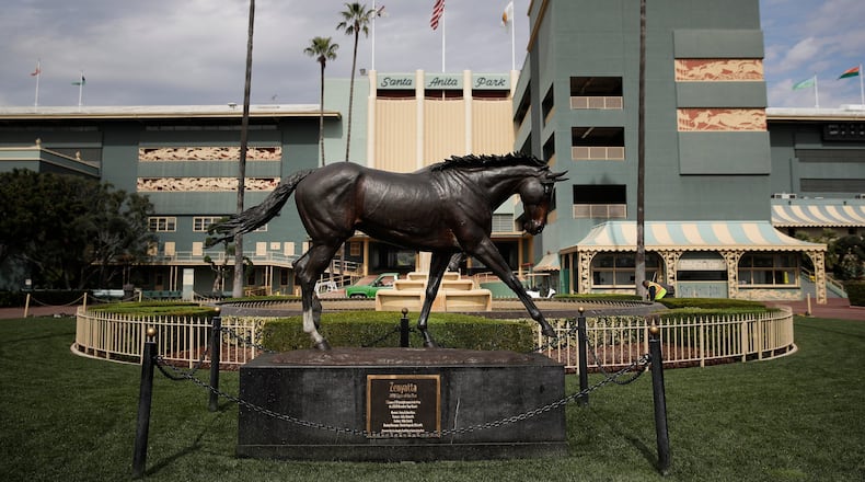 In this March 5, 2019, file photo, a statue of Zenyatta stands in the paddock gardens area at Santa Anita Park in Arcadia, Calif. (AP Photo/Jae C. Hong, File)