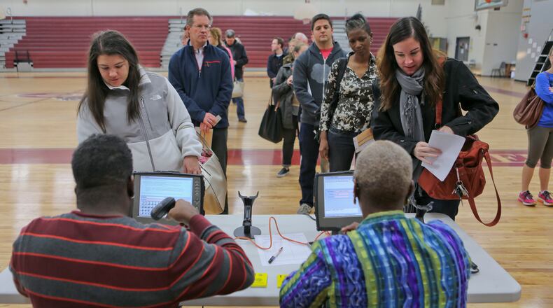 November 4, 2014 Atlanta: At Grady High School in Atlanta, long lines opened the precinct Tuesday, Nov. 4, 2014. JOHN SPINK/JSPINK@AJC.COM