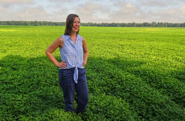 Farmer Casey Cox of Longleaf Ridge Farms stands in a peanut field on the property in Camilla. (Chris Hunt for The Atlanta Journal-Constitution)
